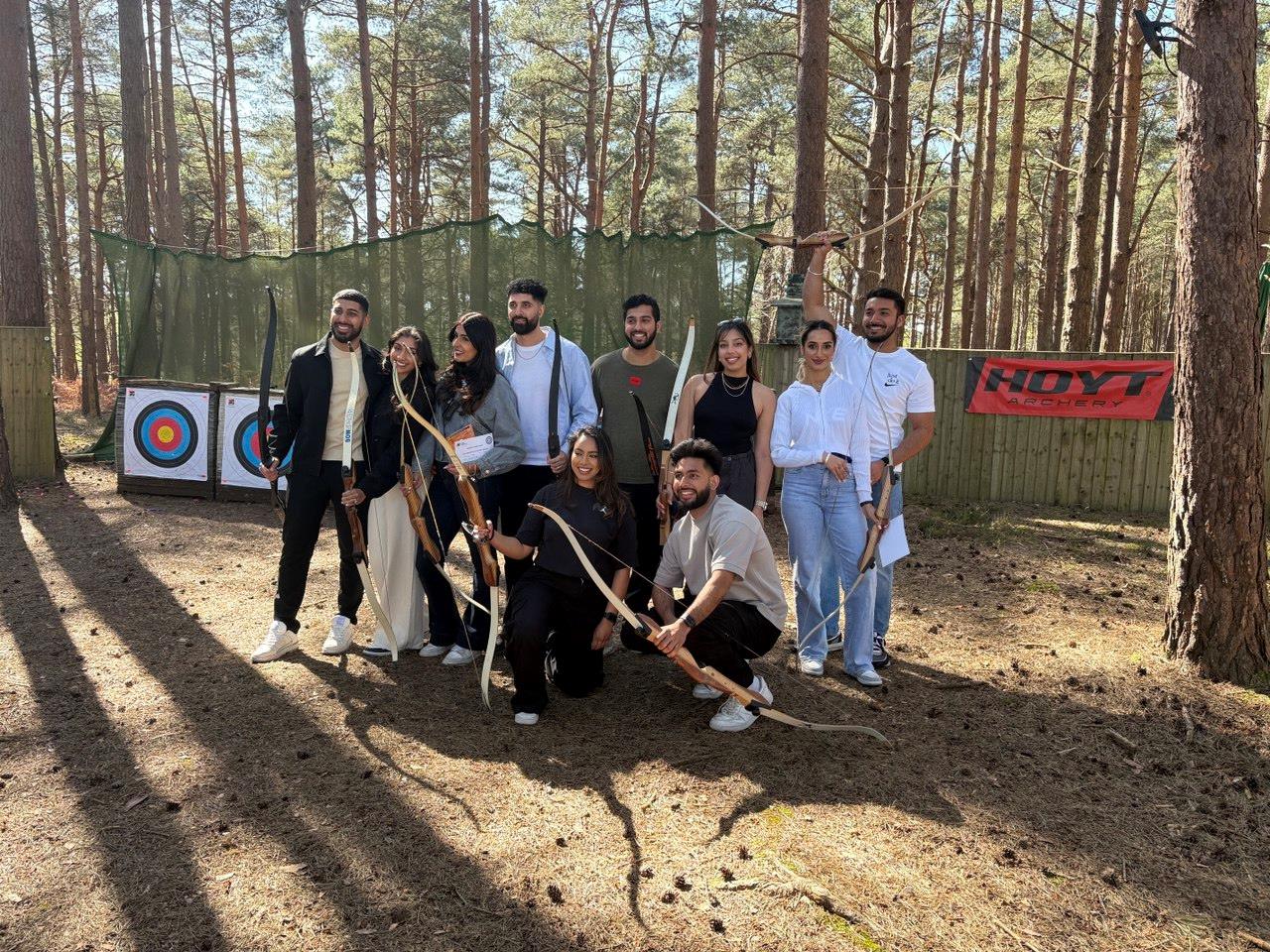 Group of participants during an archery session in the woods