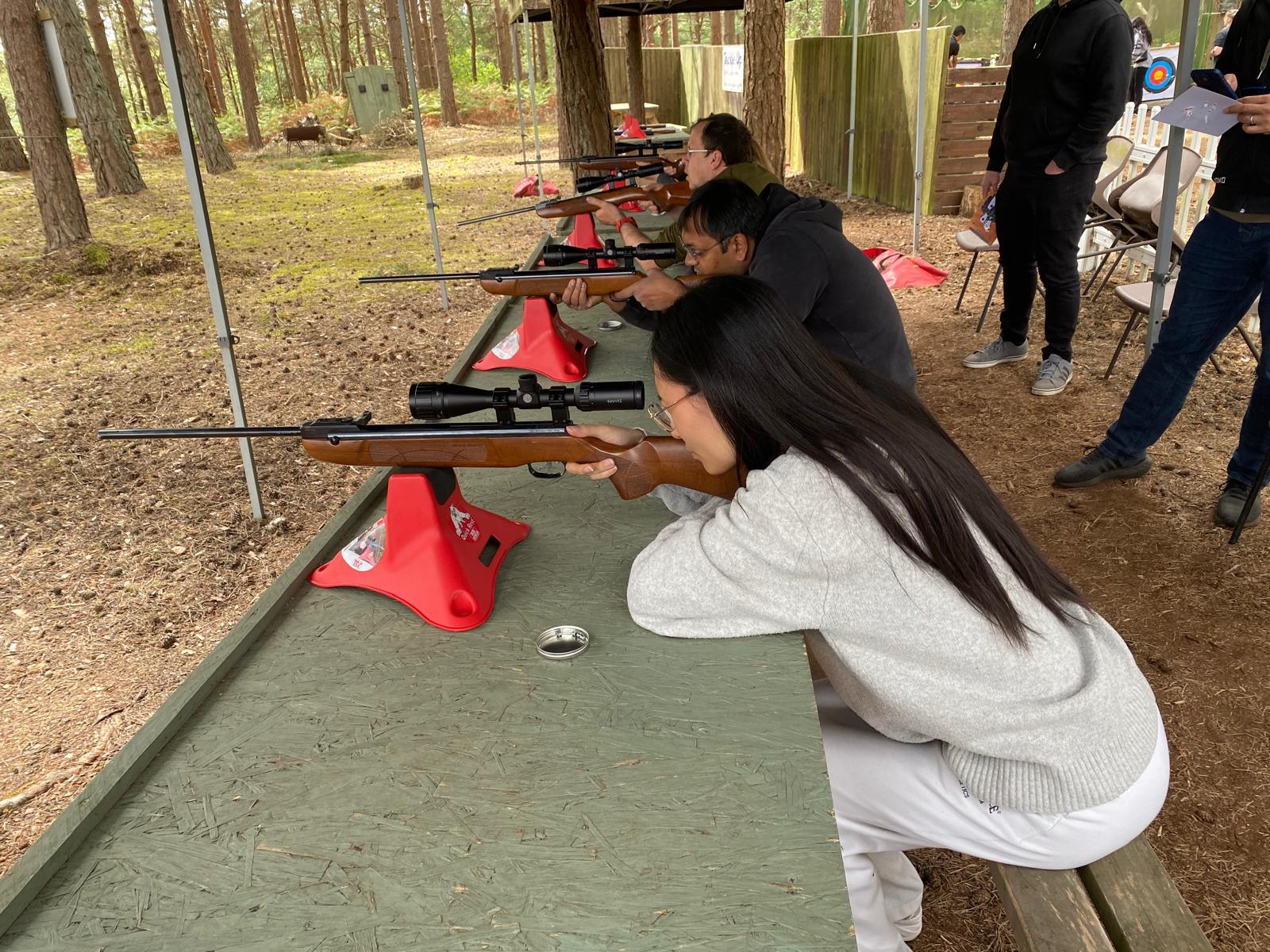 Group taking part in a rifle shooting session at the outdoor range